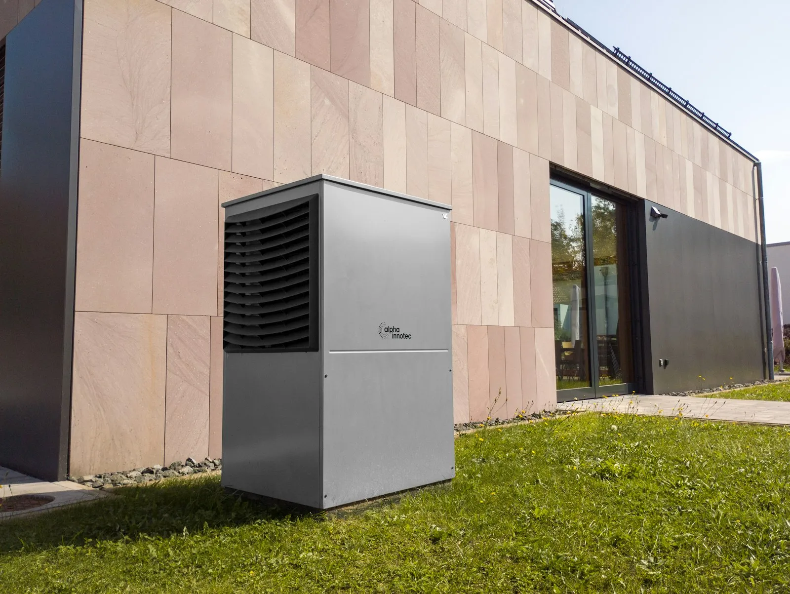 Technician servicing an outdoor air conditioning condenser unit