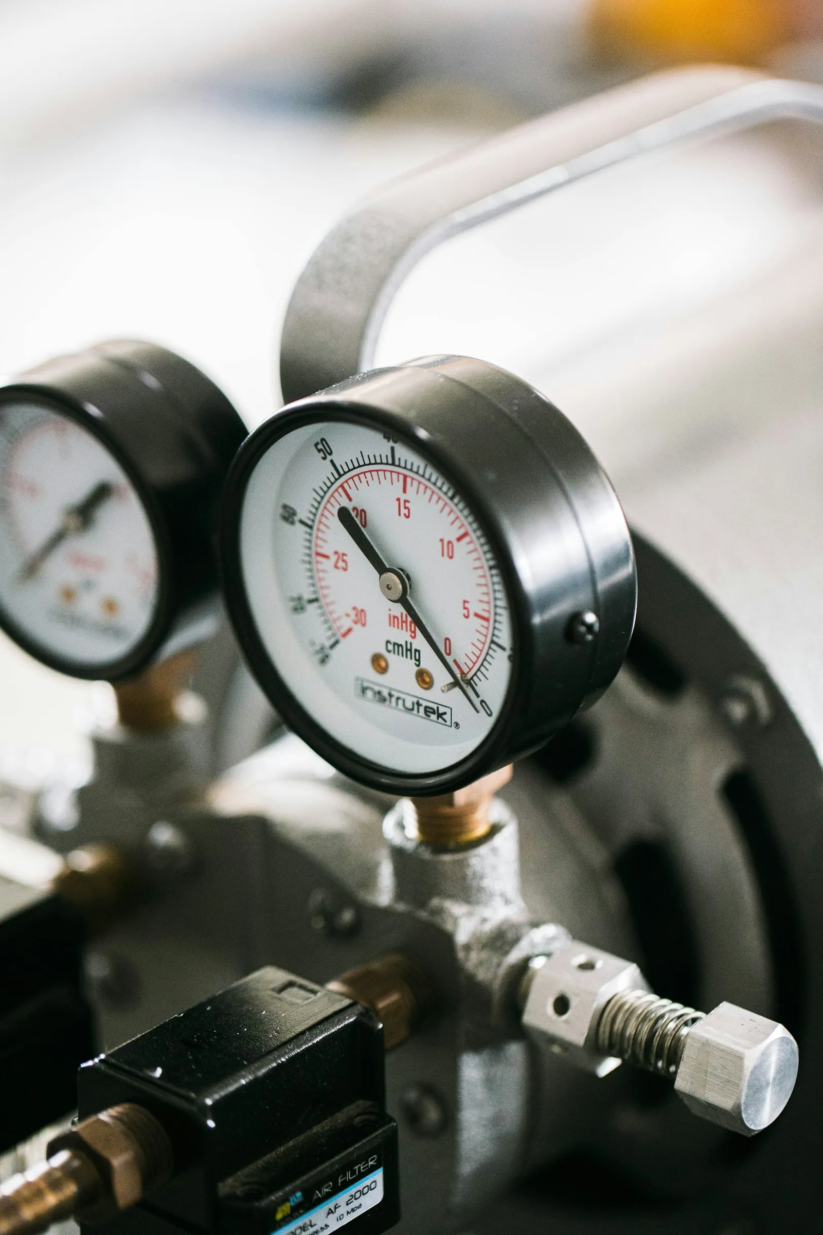 Technician performing a maintenance check with refrigerant gauges