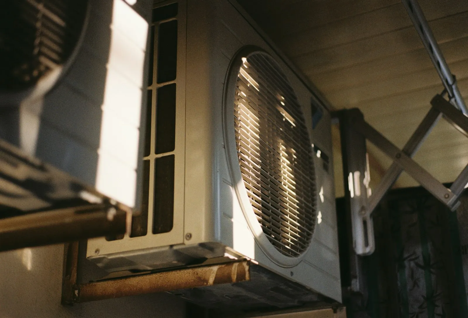 Refrigerant gauges connected to an outdoor AC unit during service