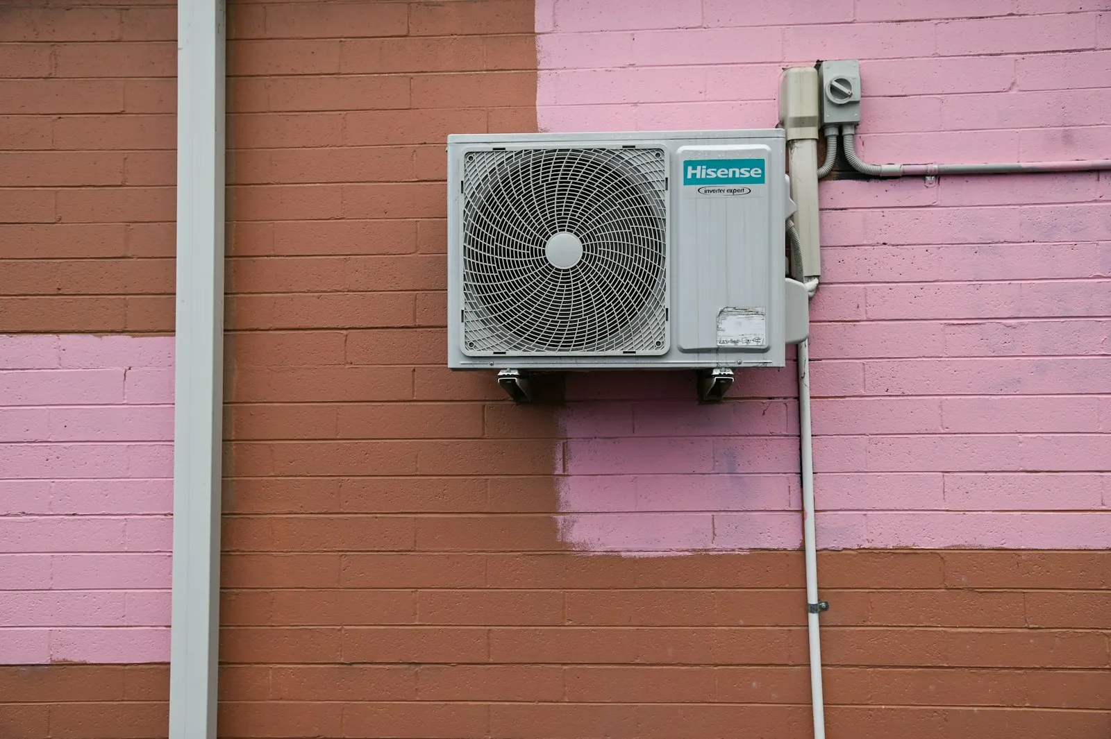 Close-up of a modern air conditioner condenser fan grille